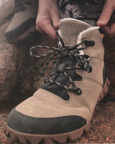 Shop the women's Arcata collection featuring a group of people on a snow bank.