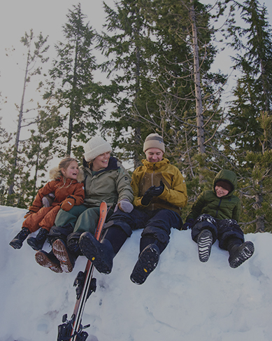 Shop our best sellers for the whole family featuring a family sitting on a snow drift.