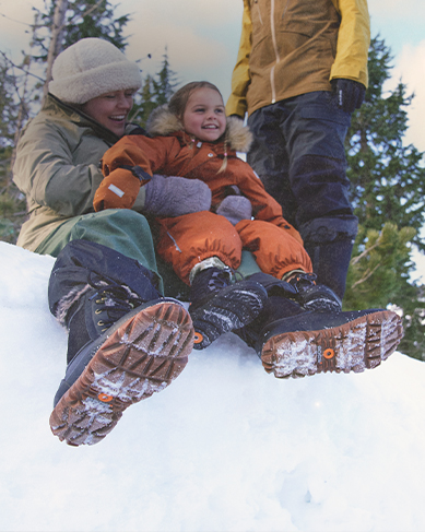 Shop the women's Arcata featuring a woman sitting in the snow with a young girl.
