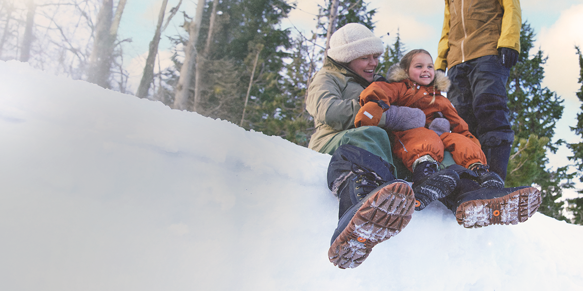 Shop the women's Arcata featuring a woman sitting in the snow with a young girl.