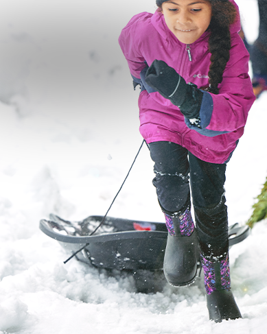 Get free 2 day shipping featuring a girl pulling a sled through the snow.