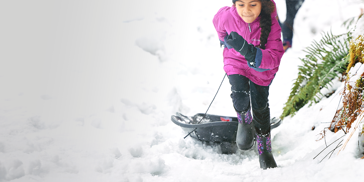 Get free 2 day shipping featuring a girl pulling a sled through the snow.