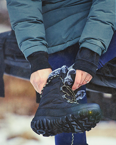 Shop the women's Cedar Quilt Lace featuring a women putting on the style.