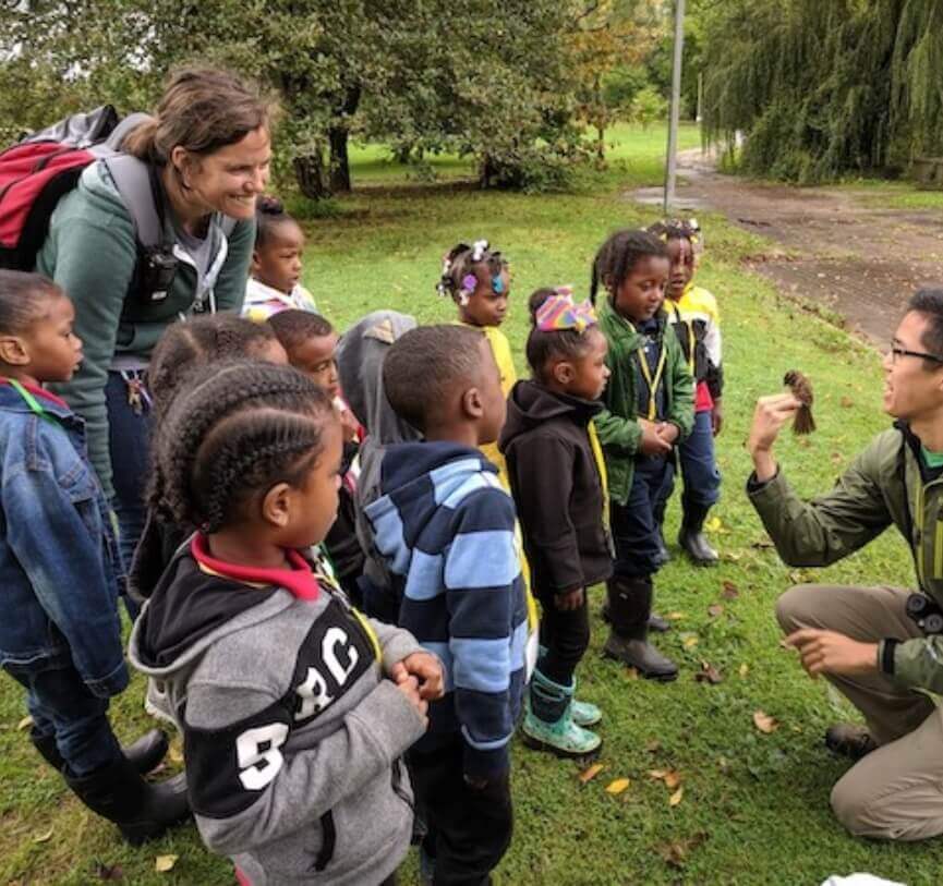 Our Featured Partners. Click here to learn more about kids outdoor education programs that provides experiences where youth learn by doing. an adult who is showing them a bird.