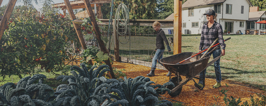 Shop our new arrivals featuring a mother and daughter walking in a garden.