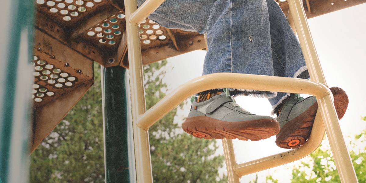 Image features the Skyline Kicker Low in green on a playground.
