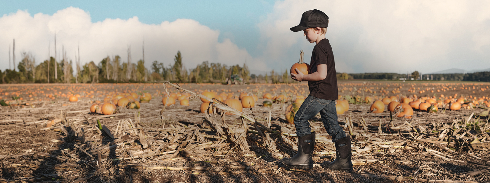 Shop the Kids Classic Seamless featuring a kid in a pumpkin patch with his classic seamless on.