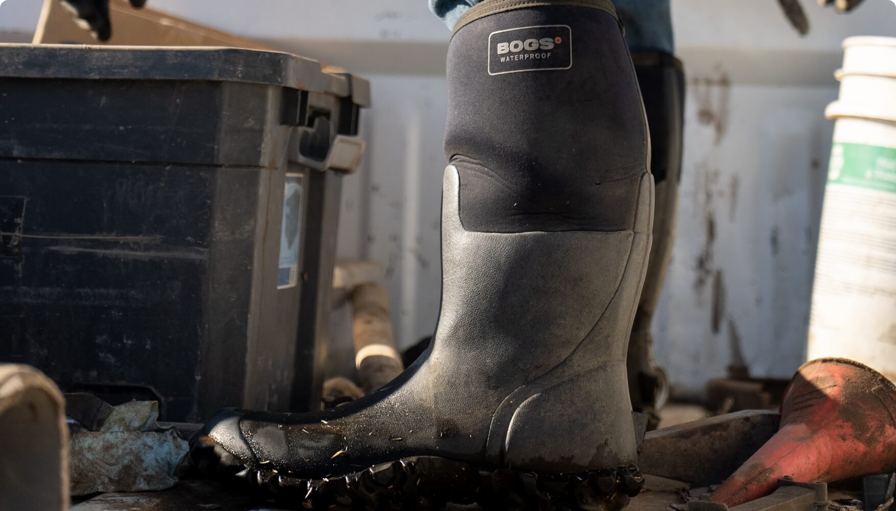 Image features close up view of BOGS Men's Insulated Waterproof                   Work Boot in Black.