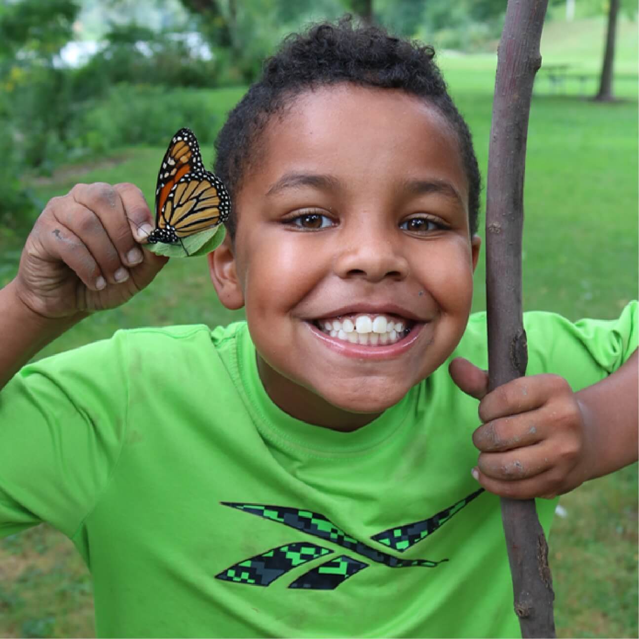 Our Featured Partners.  Click here to learn more about the Urban Ecology Center that connects youth in cities to nature and each other. The picture shown is a kid holding a butterfly and smiling.