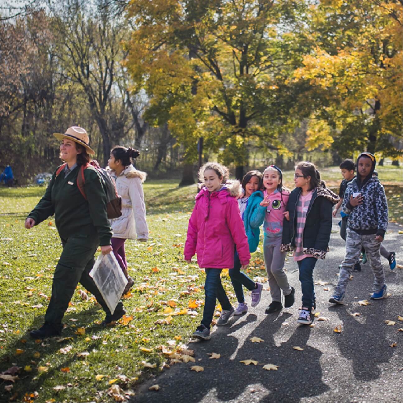Our Featured Partners.  Click here to learn more about the Mississippi Park connection organization that connects youth to environmental learning opportunities in the Mississippi river area. The picture shown is an adult walking kids outside in nature.